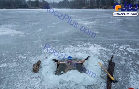 مردی که در آب های یخ زده شنا می کند +عکس