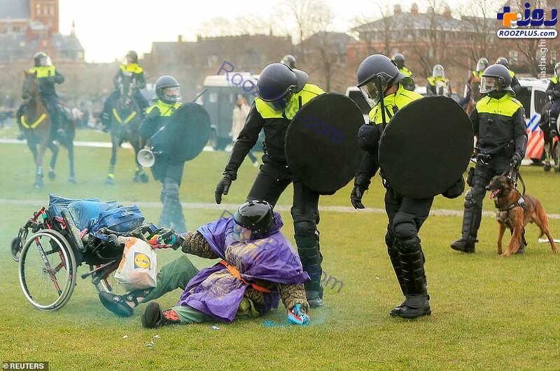 برخورد شدید پلیس با یک زن معترض/عکس