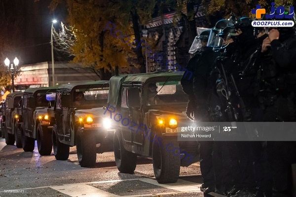 لشکرکشی خودروهای نظامی ارتش آمریکا مقابل معترضان +عکس