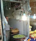 تصویر حسن روحانی در یک میوه فروشی+عکس