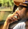 سیگار کشیدن نوید محمدزاده در خیابان سوژه شد/عکس