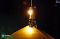 عکس/ تعویض پرچم گنبد حرم رضوی در شب میلاد امام رضا(ع)