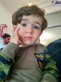 تصویر کودک یک و نیم ساله که پدرش توسط اسراییل به شهادت رسید