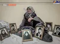 یک مادر در کنار قاب عکس 6 فرزند شهیدش+عکس