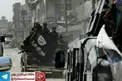 گرداندن پرچم وارونه داعش در سطح شهر موصل +عکس