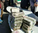 عکس/ کشف پول‌های سرقت شده بانک پاسارگاد پس از دستگیری سارقان