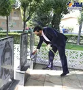 وزیر جوان بر سر مزار شهدا/عکس