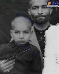 تصویری قدیمی از حسن روحانی در آغوش پدر